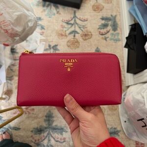 Authentic Prada pink Vitello Daino leather continental wallet.